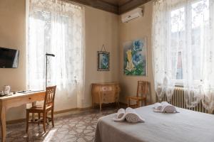 Postel nebo postele na pokoji v ubytování BB La Bella Addormentata e il Principe Calaf