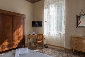 TV a/nebo společenská místnost v ubytování BB La Bella Addormentata e il Principe Calaf