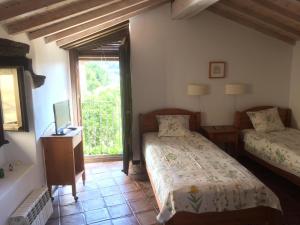 Posteľ alebo postele v izbe v ubytovaní Casa Rural Hosteria Cantarranas