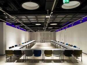 a long conference room with a long table and chairs at Nordic Light Hotel in Stockholm