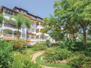 a building with a garden in front of it at Dama de Noche in Marbella