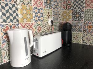 two appliances sitting on a counter in a kitchen at Central Tavira apartment, Casa Oliverio in Tavira
