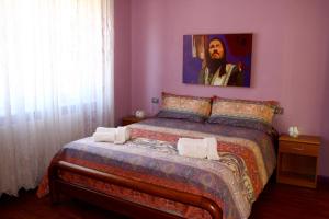 Postel nebo postele na pokoji v ubytování BB La Bella Addormentata e il Principe Calaf