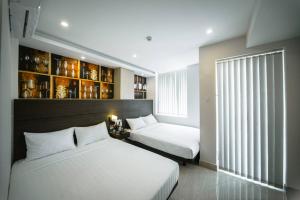 Giường trong phòng chung tại Duy Ninh Hotel