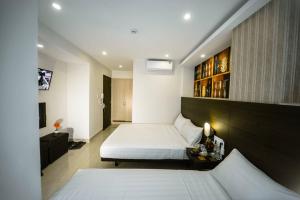 Postel nebo postele na pokoji v ubytování Duy Ninh Hotel + 20 fotografií