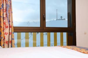 Postel nebo postele na pokoji v ubytování Pic Maià Mountain Hotel