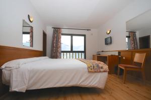 Postel nebo postele na pokoji v ubytování Pic Maià Mountain Hotel