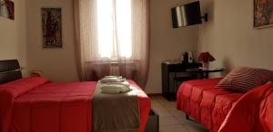 Postel nebo postele na pokoji v ubytování B&B Pierilu'