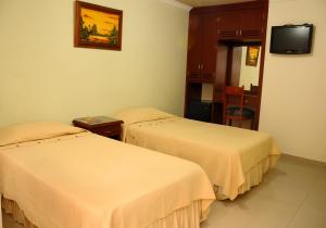 Postel nebo postele na pokoji v ubytování Hotel Napolitano