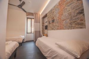 Tempat tidur dalam kamar di Kallisté