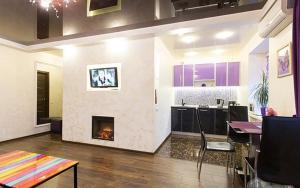 a living room with a fire place in the wall at Kharkiv Center Apartment on Hoholya Str, Poetry square in Kharkiv