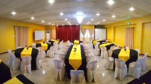 a banquet hall with tables and chairs in a room at Domsowir Hotel and Restaurant in Borongan