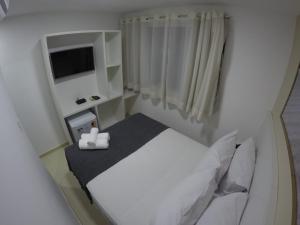Postel nebo postele na pokoji v ubytování Pousada Kanoas