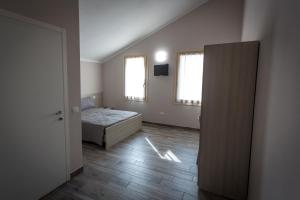 Posteľ alebo postele v izbe v ubytovaní Agriturismo Corte Casello