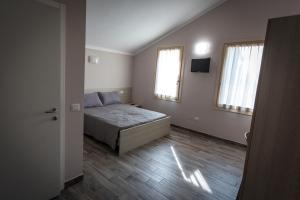 Posteľ alebo postele v izbe v ubytovaní Agriturismo Corte Casello