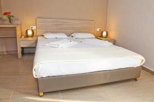 Postel nebo postele na pokoji v ubytování Hotel Stella