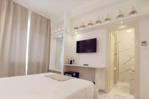 Posteľ alebo postele v izbe v ubytovaní FLOS Guest House