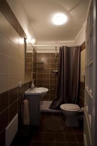 a bathroom with a sink and a toilet and a shower at Casa Annunziata, Borgo e mare a Badolato in Badolato