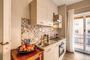A kitchen or kitchenette at Aura Paradise Apartment - With parking garage