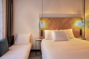 Postel nebo postele na pokoji v ubytování Hotel the Match