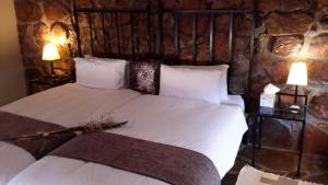 Tempat tidur dalam kamar di Khan River Lodge