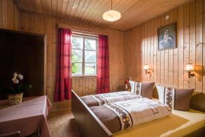 Ένα ή περισσότερα κρεβάτια σε δωμάτιο στο Apartments Ferienhaus Ortner