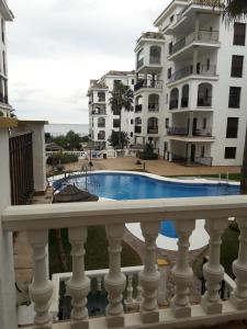 a view of a swimming pool from a balcony of a building at Marina de la duquesa 602 in Castillo de Sabinillas