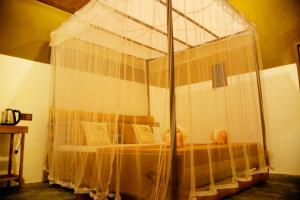 Letto o letti in una camera di Hasthi Safari Cottage