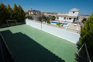 a tennis court on top of a house at Villa Isabel in Murcia