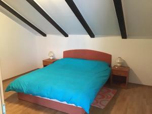 Posteľ alebo postele v izbe v ubytovaní Apartman Carina