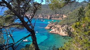 a view of a river with boats in the water at Bandol nature et loisirs: Parking/ Piscine in Bandol