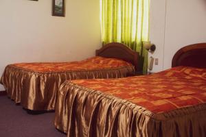 Cama ou camas em um quarto em Hotel Internacional