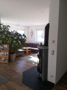 A television and/or entertainment centre at Ferienhaus Hubertus Tirol 1-8 Personen