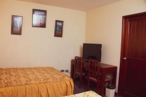 Cama ou camas em um quarto em Hotel Internacional