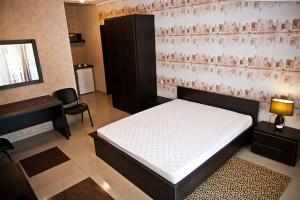 Postel nebo postele na pokoji v ubytování Privat Kharkov + 4 fotografie
