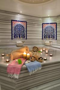 a room with a table with candles and stained glass windows at Sorriso Hotel in Istanbul