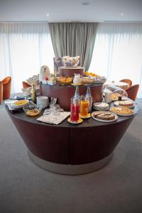 a table full of food and drinks on a table at Hotel dei Gonzaga in Reggiolo