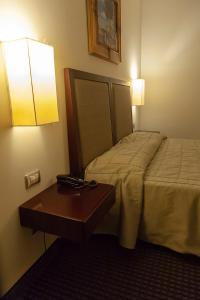 Postel nebo postele na pokoji v ubytování Hotel dei Gonzaga