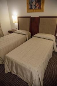 Postel nebo postele na pokoji v ubytování Hotel dei Gonzaga
