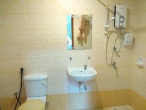a bathroom with a toilet and a sink at Suria Apartment 1BEDROOM Bukit Merah in Simpang Ampat Semanggol