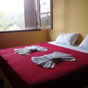 Kama o mga kama sa kuwarto sa hostel MdeMarilia