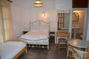 Postel nebo postele na pokoji v ubytování Hotel Rigakis