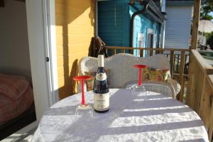 two bottles of wine sitting on a table on a porch at Bonheur partagé in Lévis +13 photos