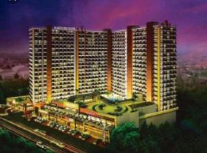 a rendering of a large apartment building at night at Studio Unit Cityland Prime Residence in Tagaytay