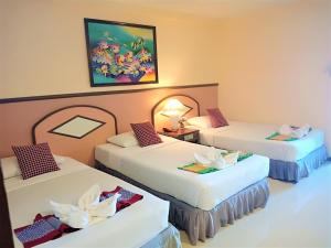 Giường trong phòng chung tại D2 lamoon resotel