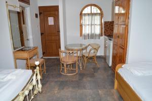 Postel nebo postele na pokoji v ubytování Hotel Rigakis