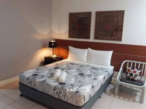 Postel nebo postele na pokoji v ubytování VL Garden Suites