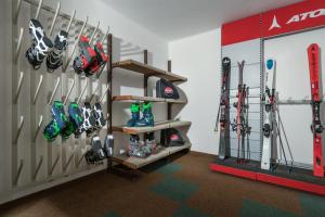 a room with skis and ski equipment on a wall at Appartment Venter Bergwelt in Vent