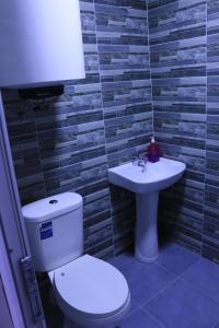 Baðherbergi á Inga Jafaridze Guesthouse Pele