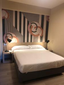 Postel nebo postele na pokoji v ubytování Albergo Tre Pozzi